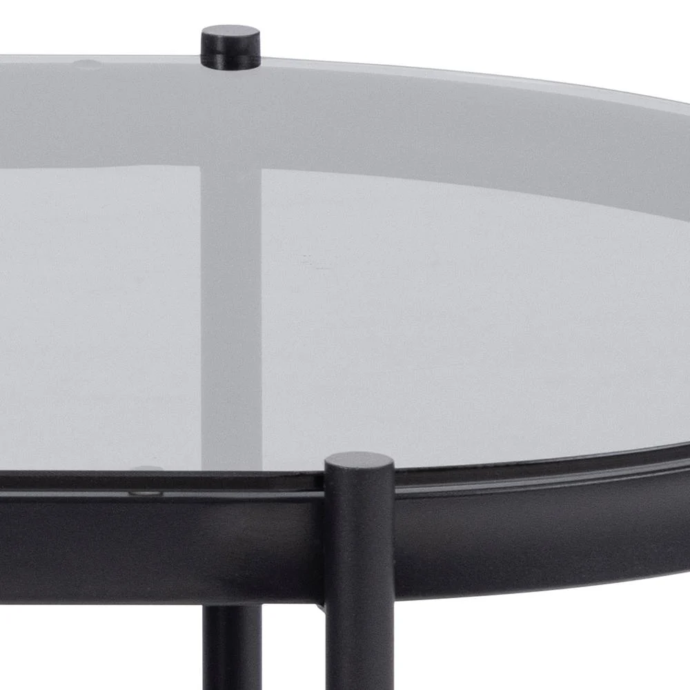 Close-up van de Salontafel Zwart, Grijs 50 x 42 CM Rond met een modern rond tafelblad van kunststof met een zwart frame en poten, waardoor de rand van het tafelblad en de ondersteunende structuur eronder benadrukt worden.