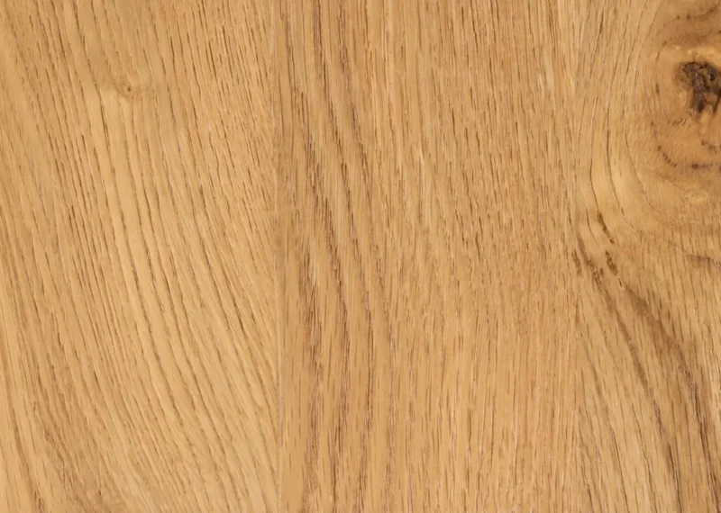 Close-up van de Salontafel Rond Kunststof met een lichtbruin, houtlook oppervlak met natuurlijke nerfpatronen, subtiele knoesten en een gladde textuur in verschillende tinten bruin en beige.