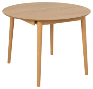 De Eettafel Nieuwe Sfeer 115 CM Rond is een ronde, uitschuifbare eikenhouten tafel met vier taps toelopende poten, afgebeeld tegen een witte achtergrond.