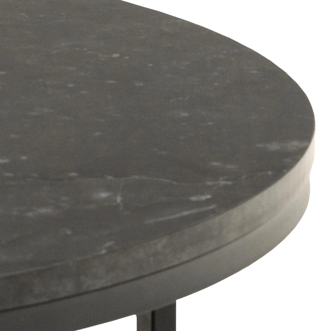 Close-up van de rand van de Salontafel Zwart 80 CM Rond Kunststof: een ronde, industriële tafel met een donker oppervlak met subtiele witte adering, ondersteund door een slank metalen frame.