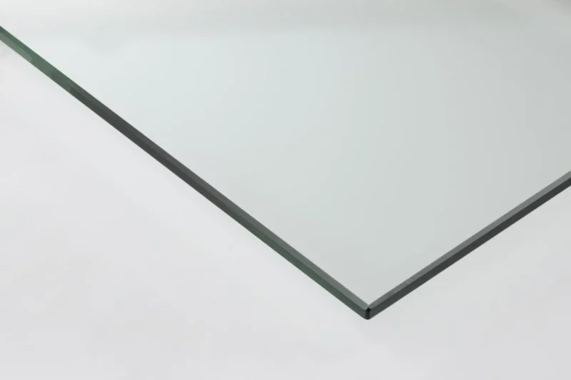 Een close-up van de Salontafel Grijs 45 x 45 CM Rechthoek gemaakt van kunststof. Je ziet het gladde, heldere oppervlak en de precieze rechthoekige randen op een witte achtergrond.