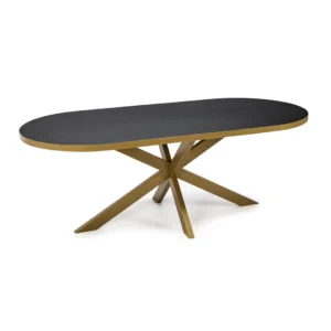 De Stalux Plat ovale eettafel 'Noud' (180 x 100) heeft een modern zwart eiken tafelblad met gouden randen en een opvallende gouden geometrische kruisvoet.