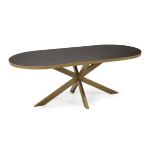 De Stalux Plat ovale eettafel 'Noud' (180 x 100) heeft een modern ontwerp met een donkerbruin houten blad, goudkleurige metalen randen en een sculpturaal goudkleurig metalen onderstel met hoekige, kruisende poten.