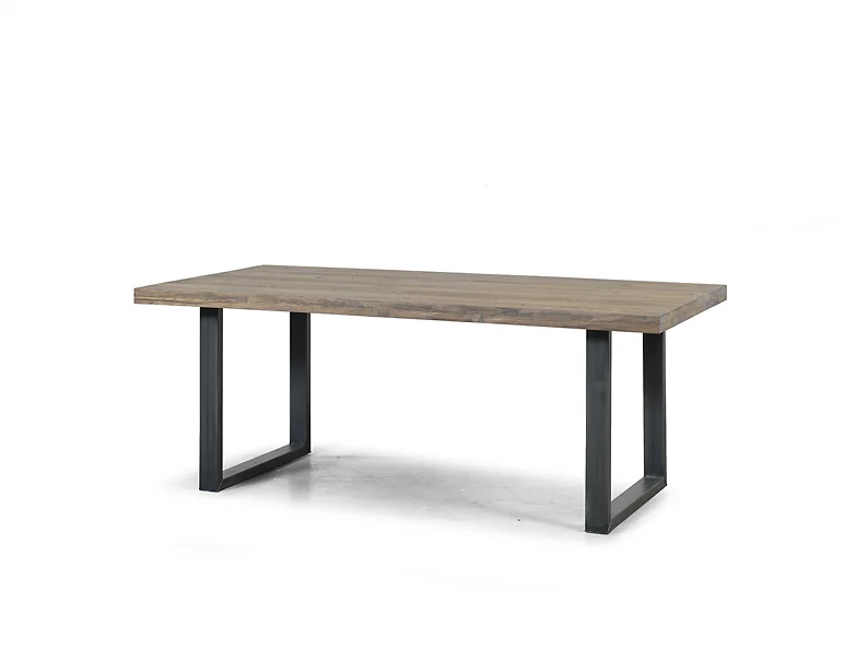 De Eettafel Montreal Whitewash - 180x100 is een rechthoekige houten tafel met een glad oppervlak en zwarte metalen U-vormige poten, tegen een effen witte achtergrond.