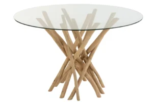 De Eettafel Branches Rond Teakhout Natuurlijk/Glas heeft een rond glazen blad en een basis gemaakt van natuurlijke teak takken gerangschikt in een kriskras patroon.