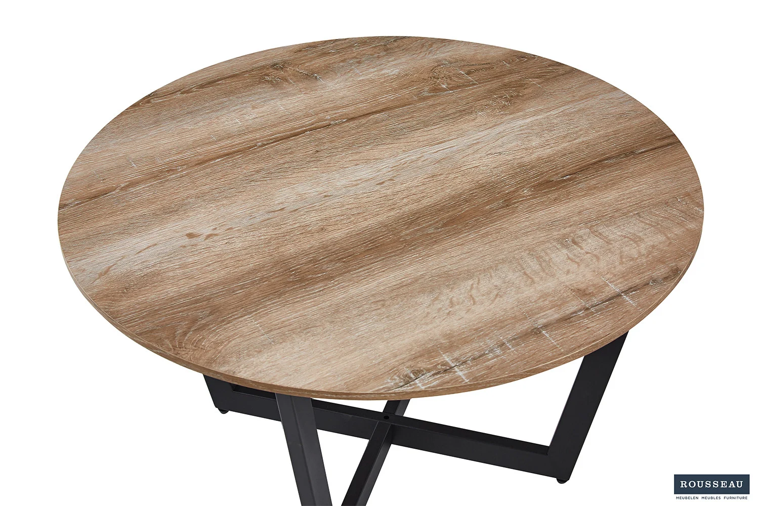 Een ronde Salontafel Compact Klassiek met een lichtbruin, gestructureerd houten oppervlak en zwarte metalen poten, van bovenaf gezien. Een klein "ROUSSEAU" logo verschijnt in de rechter benedenhoek.