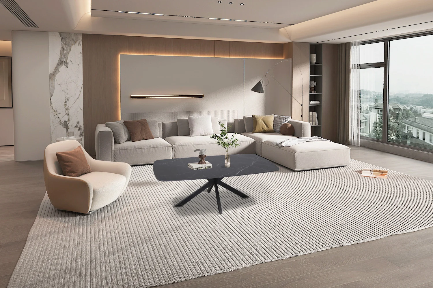 Moderne woonkamer met neutrale tinten, een grote sofa, een witte fauteuil en de 130 cm ovale stenen Salontafel Zwart, plus ramen van vloer tot plafond met uitzicht op de stad, minimalistische inrichting en natuurlijk licht.