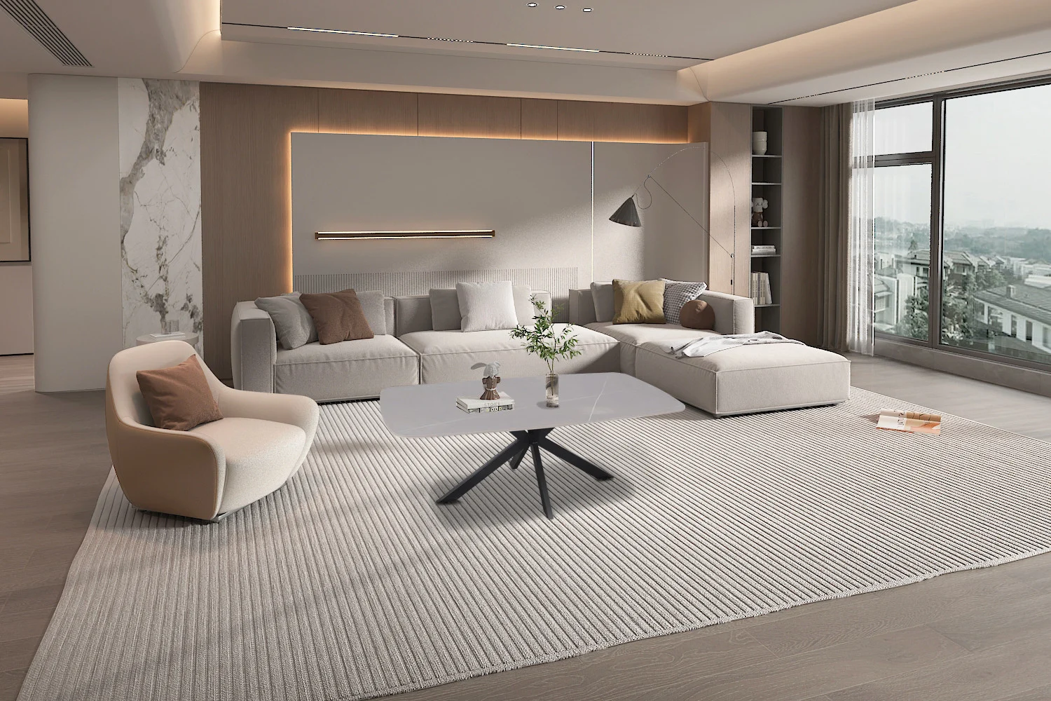 Een moderne woonkamer met een groot lichtgrijs bankstel, een crème fauteuil, een Klassiek Salontafel Grijs 130 CM Ovaal Steen, een staande lamp en uitzicht op de stad. De ruimte heeft neutrale tinten en een minimalistische inrichting.