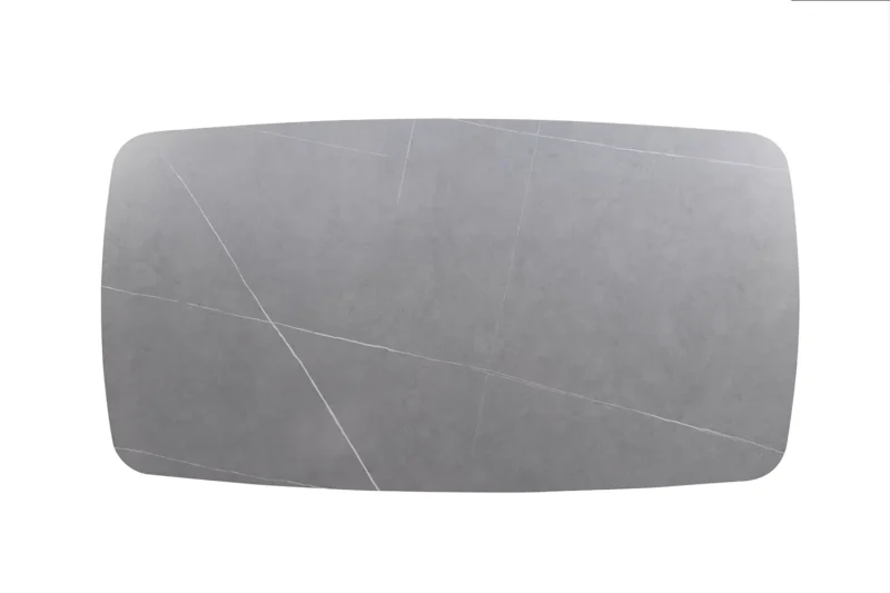 De Salontafel Grijs 130 CM Ovaal Steen is een klassieke ovale grijze salontafel met zacht afgeronde randen en subtiele witte adering, die doet denken aan steen, tegen een effen witte achtergrond.