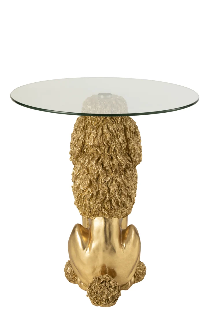 De Bijzettafel Poedel Rond Polyresin Goudkleurig is een ronde tafel van glas met een basis van goudkleurig polyresin, gebeeldhouwd als het achterwerk van een poedel, compleet met gedetailleerde krullende vacht en staart.