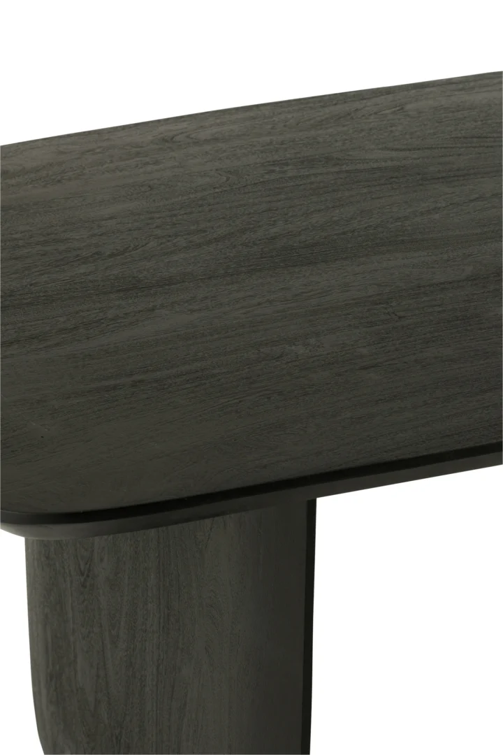 Een close-up van de Eettafel Acaciahout Zwart, met de nadruk op het gladde, rechthoekige tafelblad van donker hout en de stevige verticale poot met de kenmerkende acacia houtnerfstructuur.