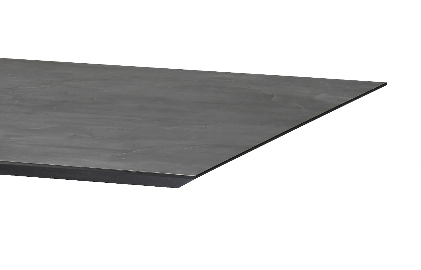 Een close-up van de hoek van de Schakel Eettafel 220x100 Rechthoekig Keramiek + Stellar toont het vlakke, donkergrijze keramische tafelblad met een gladde, matte afwerking.