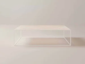 De Salontafel Wit Rond is een minimalistische salontafel met een licht houten blad en een open wit metalen frame, perfect voor lichte, neutraal gekleurde kamers.