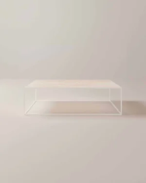 De Salontafel Wit Rond is een minimalistische salontafel met een licht houten blad en een open wit metalen frame, perfect voor lichte, neutraal gekleurde kamers.