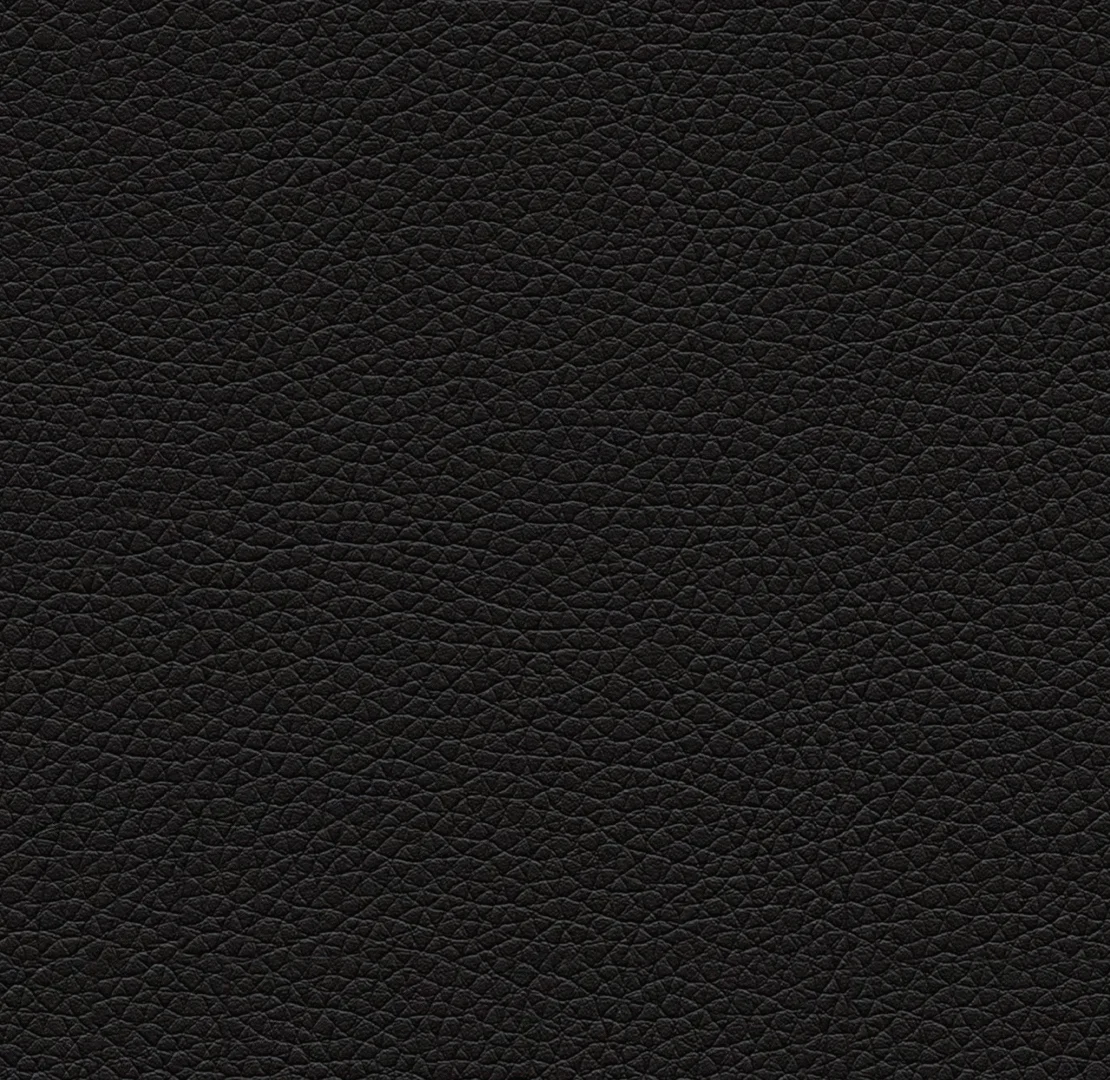 Close-up van een zwarte lederlook textuur. Het materiaal oogt zacht en heeft een subtiele glans. Ideaal voor een boxspring.