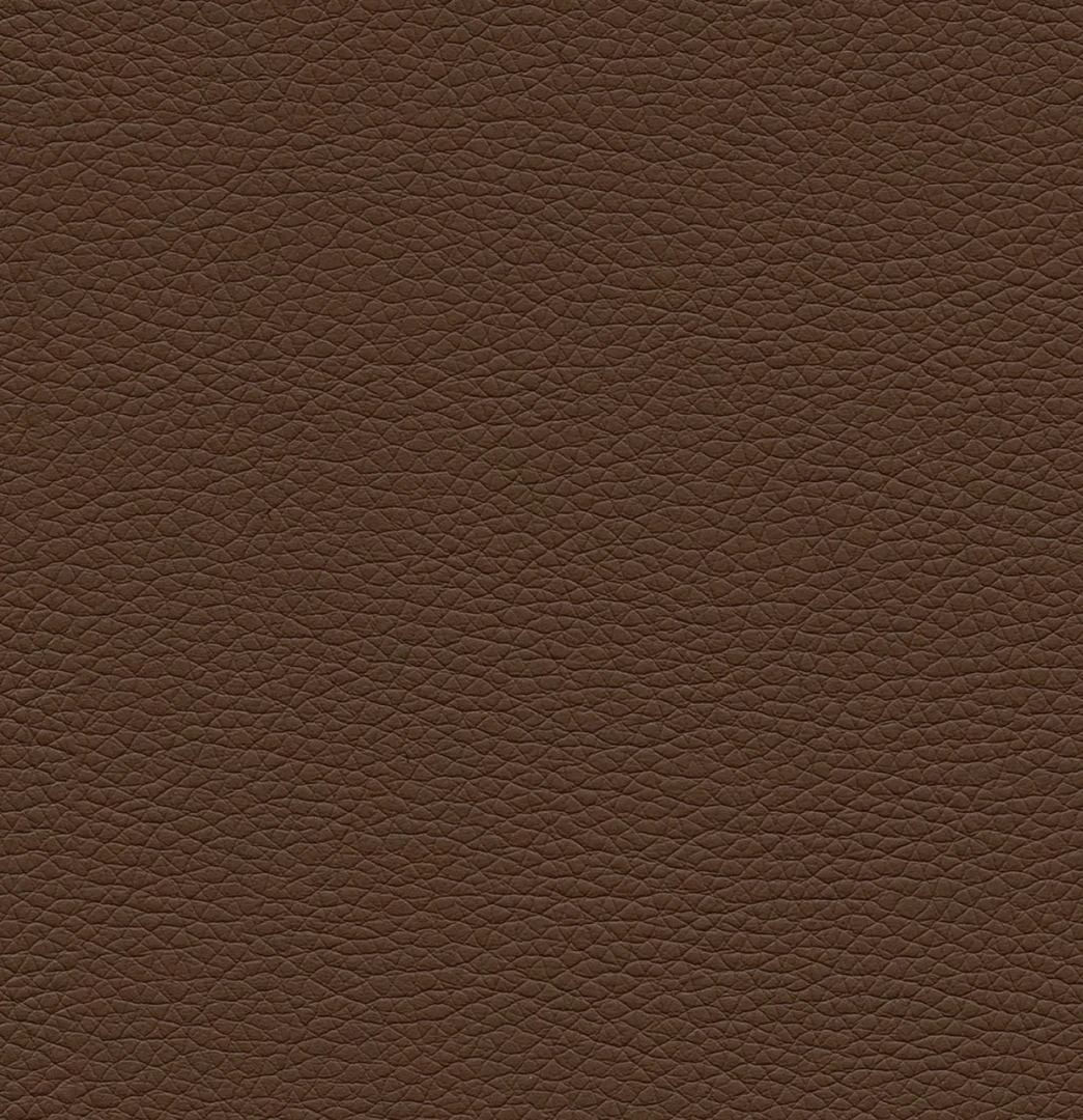 Close-up van een bruine lederlook textuur. Het materiaal heeft een fijne, subtiele nerf en een egale, warme kleur. Zacht licht.