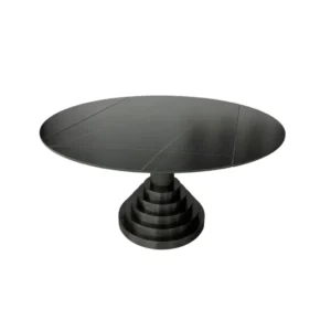 De ROSELLA DT 135/89X75 ZWART/GOUD SINTERSTEEN is een moderne ronde zwarte tafel met een glad blad met subtiele lijnen en een kenmerkend trapsgewijs voetstuk in zwart en goud sintersteen.