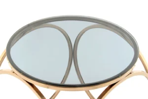 Bijzettafel Grijs Staal Compact met een rond glazen blad en een grijs stalen frame met gebogen steunen, van bovenaf gefotografeerd tegen een witte achtergrond.