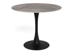 De Eettafel Malta 90 CM Rond heeft een glad keramisch blad en een matzwarte, enkelvoudige stalen voet die breder wordt aan de onderkant.