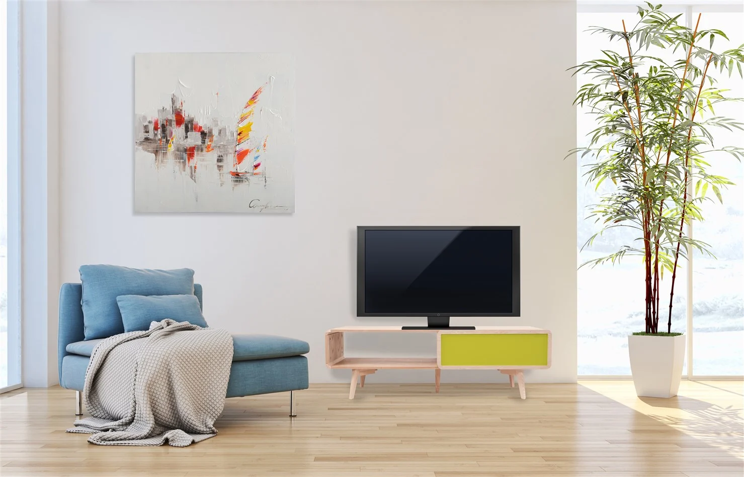 Een moderne woonkamer met een blauwe loungestoel gedrapeerd met een grijze deken, Bijzettafel Groen Rond MDF Scandinavisch ernaast, een laag tv-meubel met een tv, abstracte kunst op een witte muur, een lichte houten vloer en een lichte sfeer.