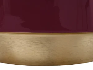 Een close-up van de Bijzettafel Rond Ijzer Design, met een glanzend kastanjebruin bovengedeelte en een geborsteld gouden ondergedeelte met een strakke horizontale scheiding tussen de afwerkingen.