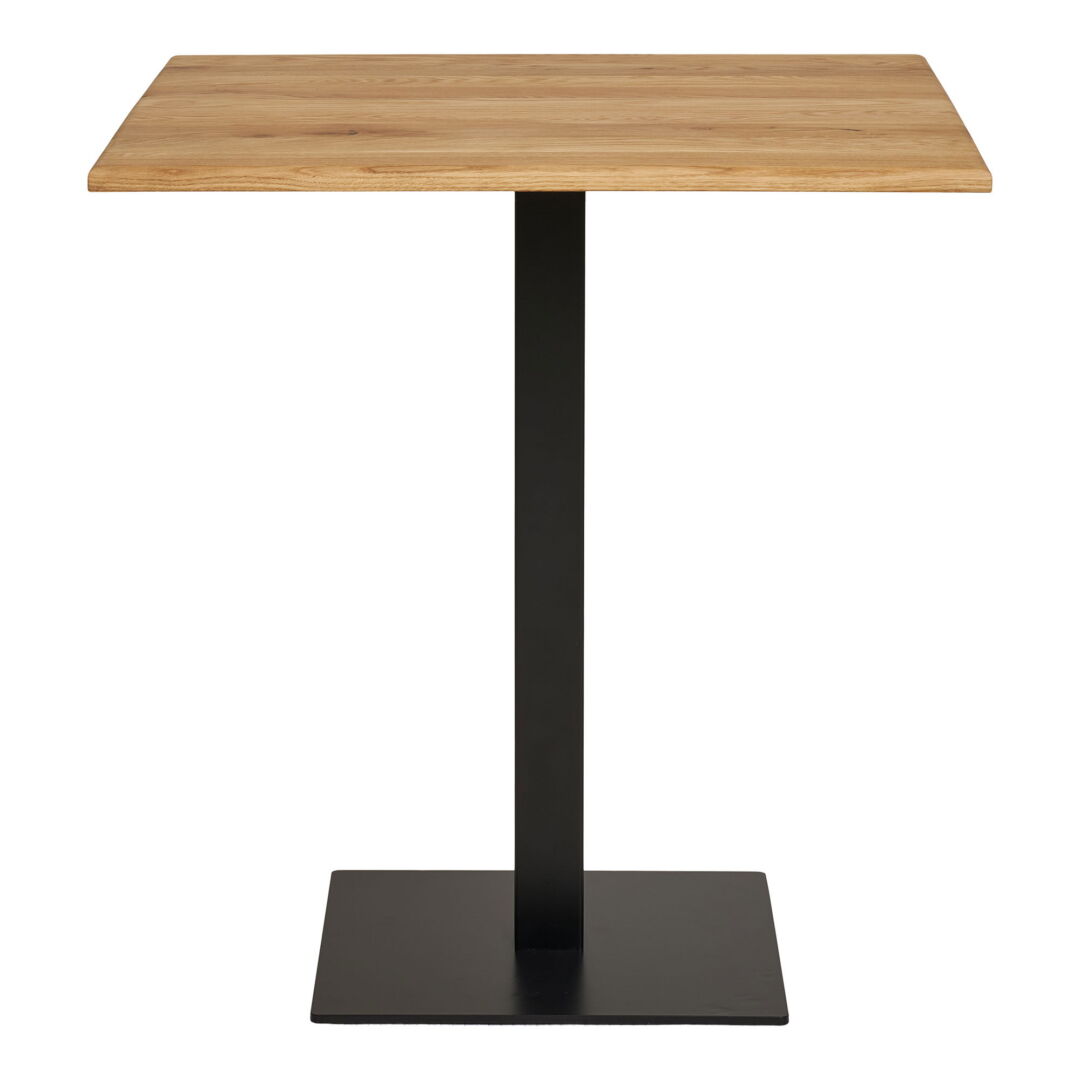 Frontal shot of a Vierkant Eettafel Lignano, showcasing a wooden tabletop and a black metal base. The lighting is neutral, highlighting the materials.