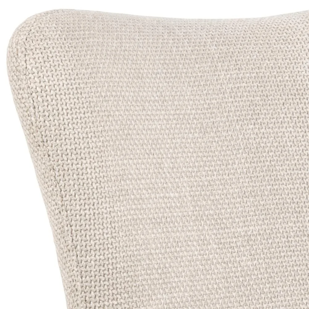 Laura eetkamerstoel: Detailopname beige stof met textuur, armleuning zichtbaar.