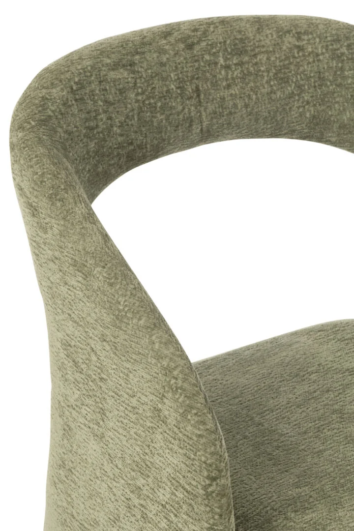 Stoel Anise Stof Beige: Close-up van een groene gestoffeerde stoel van Nieuwe Sfeer.