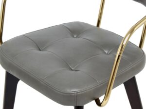 Stoel Manchester Antraciet | Nieuwe Sfeer: grijze, gecapitonneerde zitting met gouden frame.