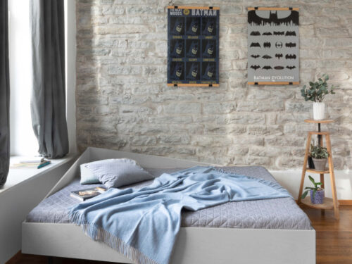 Bed Traultea hoekbed met asymmetrisch design, grijze bekleding en knusse lees- en slaapplek