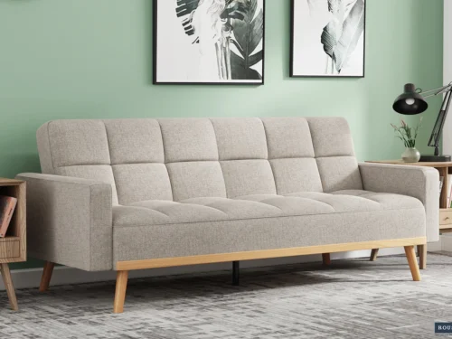 Slaapbank Haammero Beige met gewatteerde zitting, houten poten en compacte, moderne uitstraling
