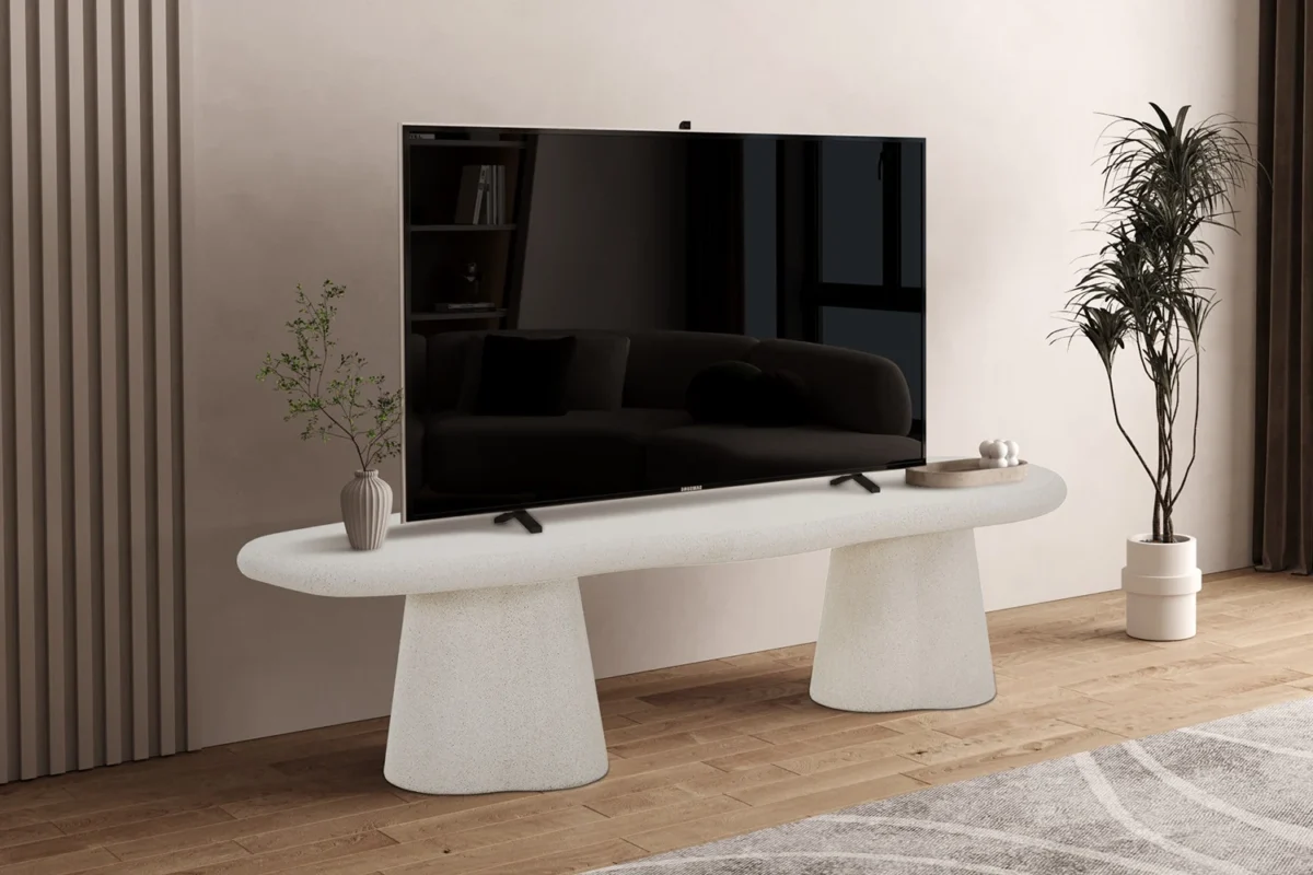 TV-meubel Traumea Beton 160 cm met betonlook, ovale vorm en stevige conische poten in een strakke woonkamer