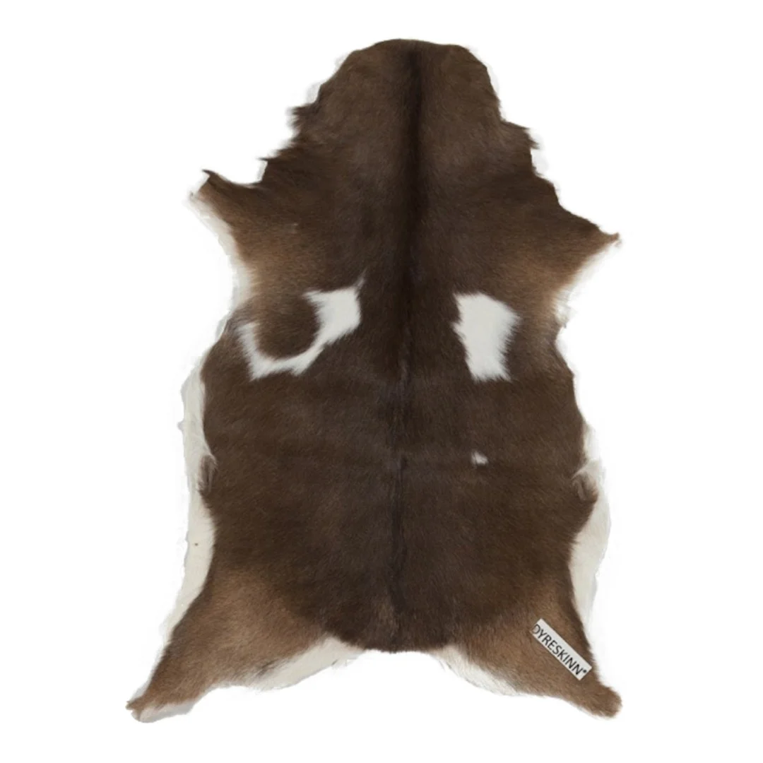 Woonaccessoire Kleennona Naturel geitenvacht in bruin-witte tinten met zachte, natuurlijke uitstraling