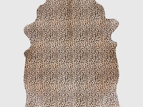Koeienhuid Cienton met panterprint, natuurlijk bont vloerkleed met speelse, luxe uitstraling
