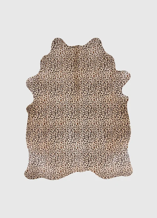 Koeienhuid Cienton met panterprint, natuurlijk bont vloerkleed met speelse, luxe uitstraling
