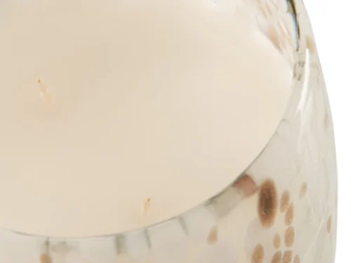 Geurkaars Ninsun in meerkleurig glas met beige was en speelse goudkleurige stippen
