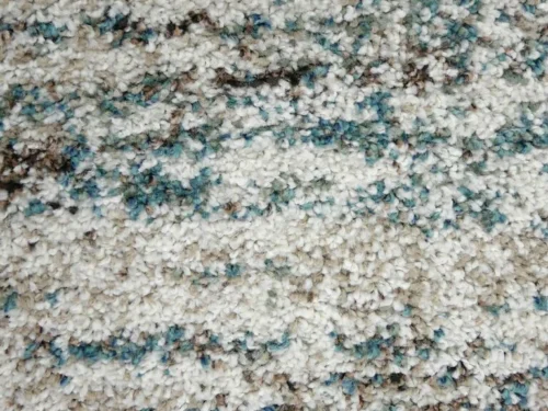 Vloerkleed Caastine 290x200 cm in kleur 6959, hoogpolig met zachte, volle structuur en rustige mix van blauw en beige