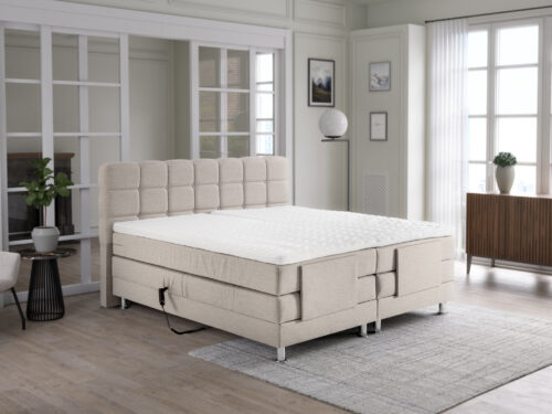 Beige Boxspring Baurmil 180x200 met hoofdbord en elektrische verstelling in stijlvolle slaapkamer