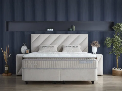 Beige SKYBEDD Shinebedd boxspring 160x200 met topdekmatras en zwarte kegelpoten in zachte Knuffel-stof