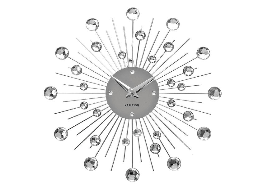 Karlsson Sunburst wandklok met zilverkleurig design en glanzende kristallen stralen rond het uurwerk
