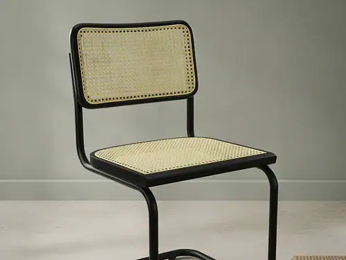 Eetkamerstoel  Flelia zwart rotan met armleuning metalen frame
